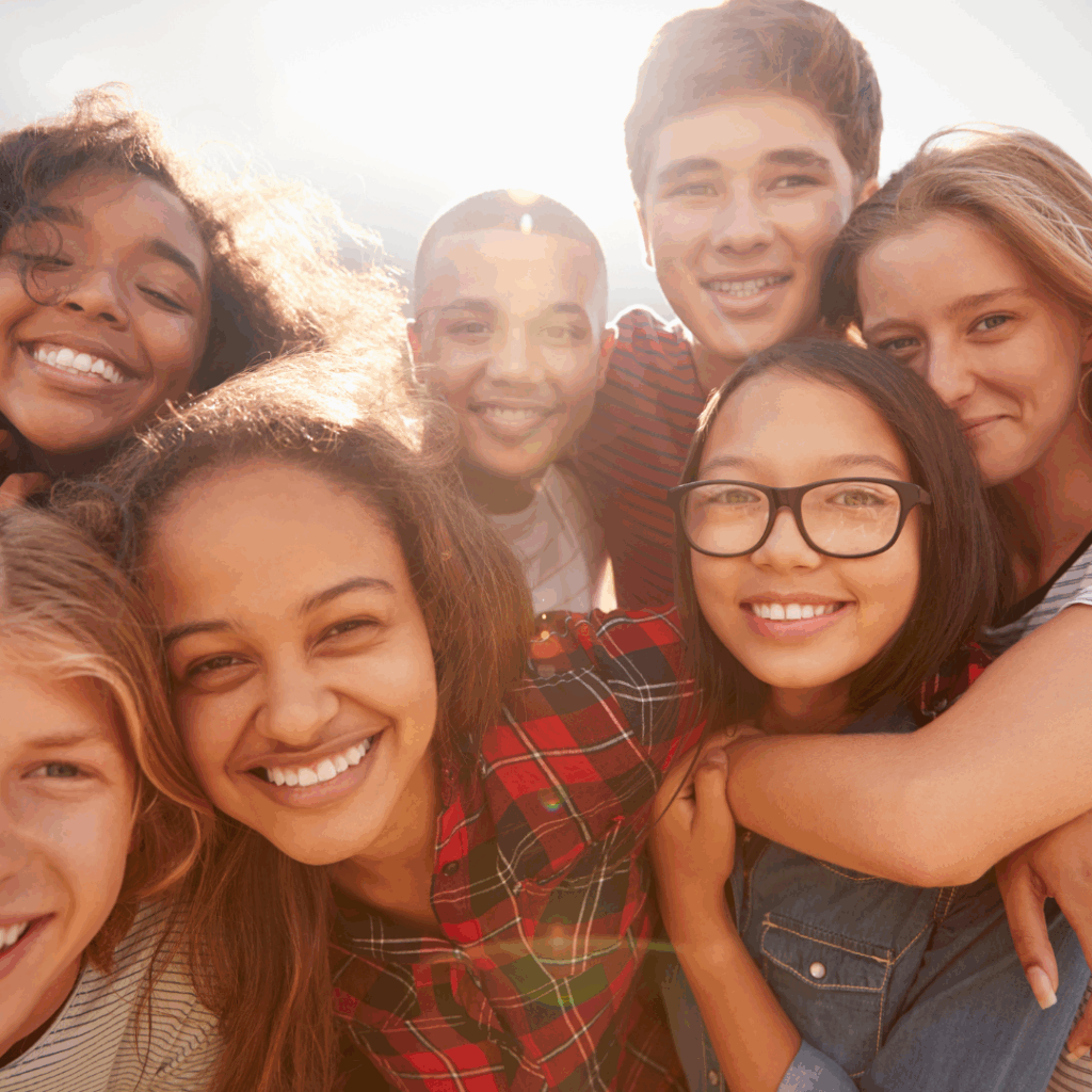 a large group of teenagers smiling together